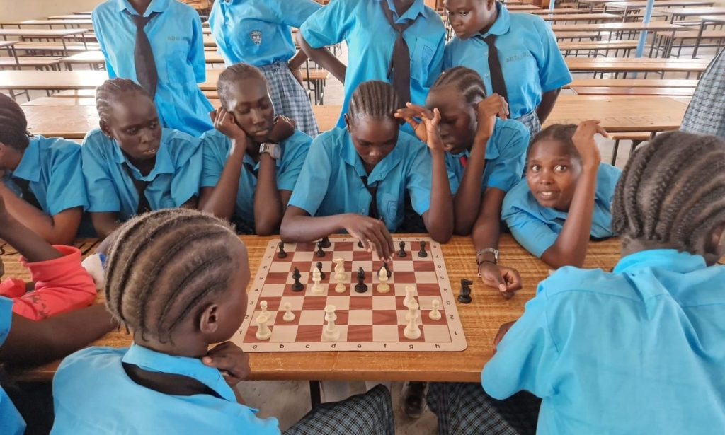 Students playing chess, Kenya