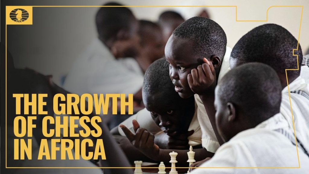 Students engaged in a chess game, Africa Day feature